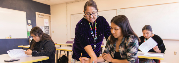 Teacher instructing student
