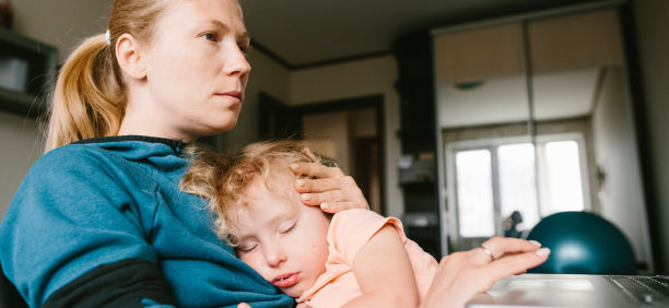 Mother cares for child while working