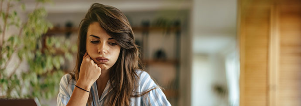 Woman looks confused while reviewing benefits