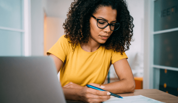 Woman goes through checklist at work
