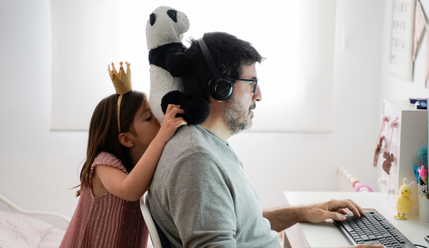 Dad and daughter work remotely