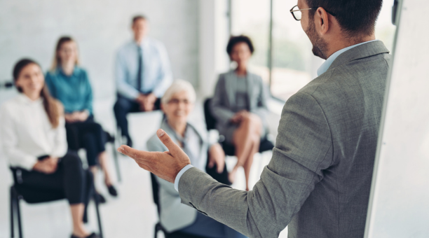 Employer giving a presentation to employees. 