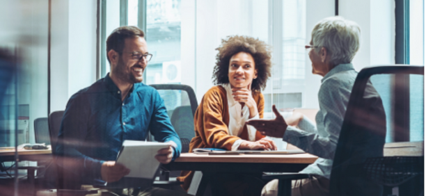 Group of employees meet