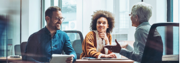 Group of employees meet